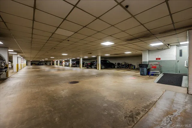 a view of parking garage with cars