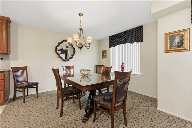 a view of a dining room that has a table and chairs