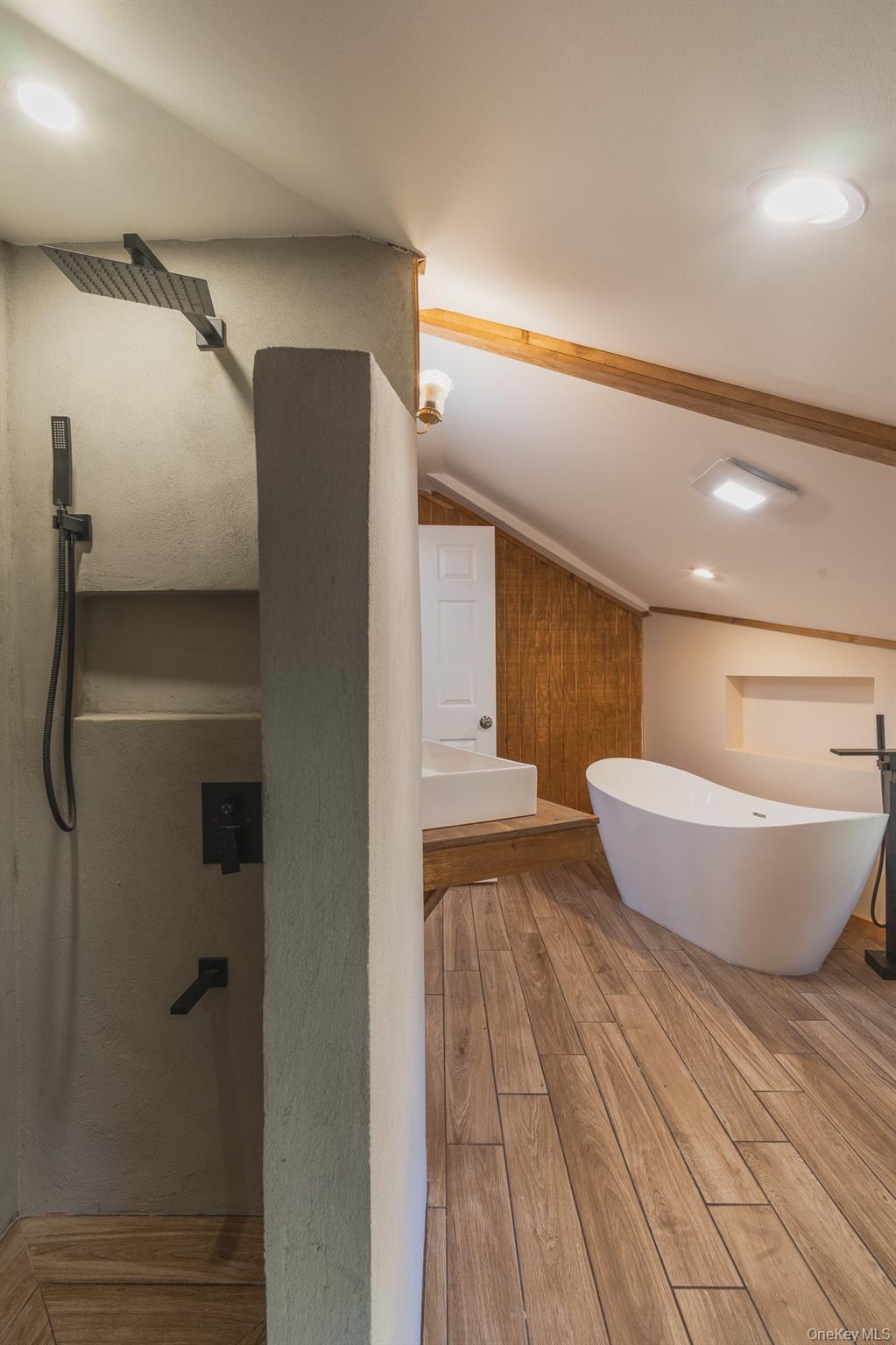 15 Deans Road Napanoch, NY 12458 - Photo 12 of 21 Bathroom featuring lofted ceiling, wood finished floors, and a freestanding bath