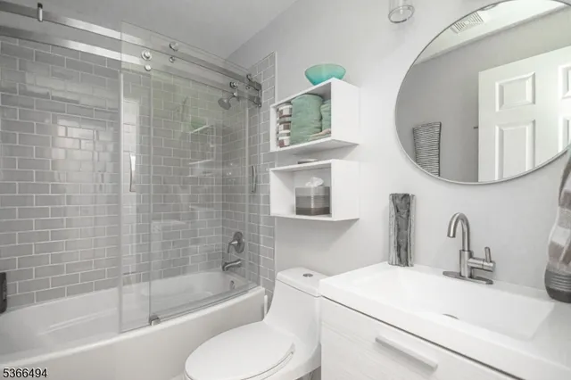 a kitchen with stainless steel appliances a sink stove and refrigerator