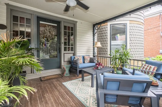 a outdoor living space with furniture and a potted plant