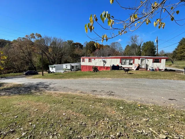 a view of yard with cars parked