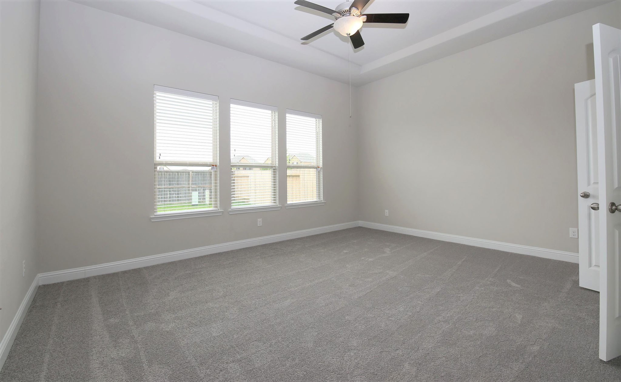 8218 Oxbow Manor Lane Cypress, TX 77433 - Photo 12 of 37 an empty room with a window and a fan