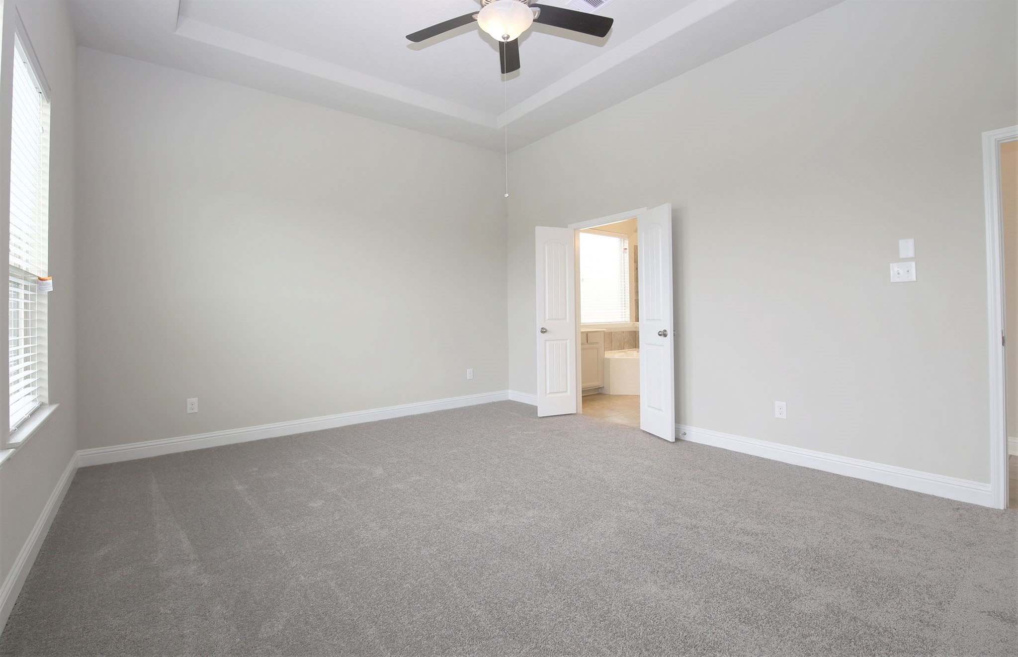 8218 Oxbow Manor Lane Cypress, TX 77433 - Photo 13 of 37 an empty room with fan and windows