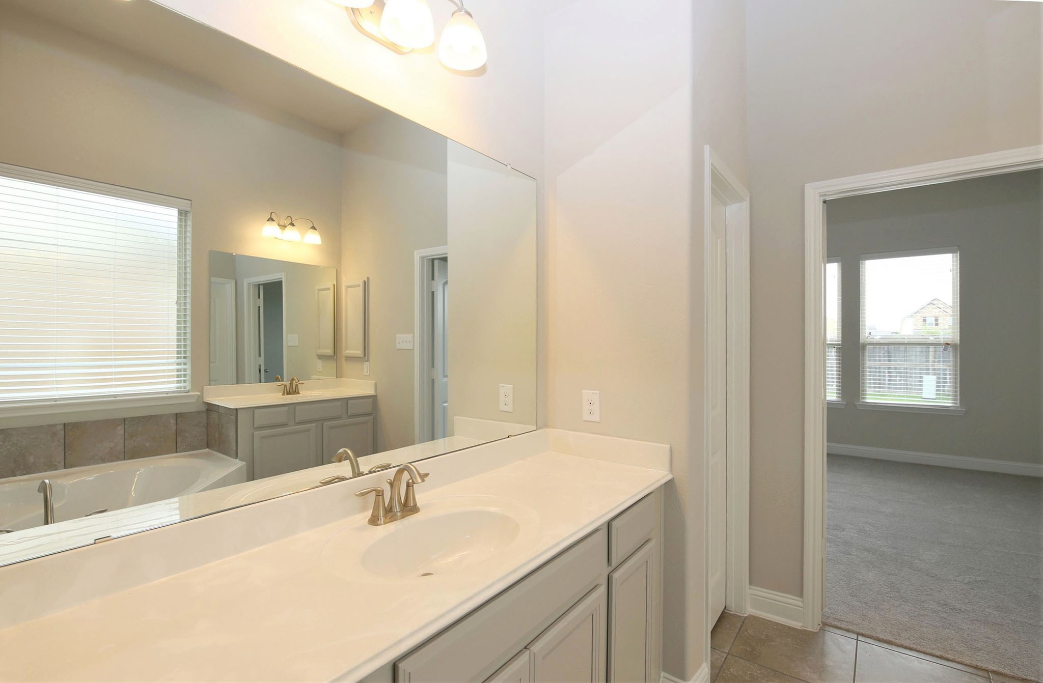 8218 Oxbow Manor Lane Cypress, TX 77433 - Photo 18 of 37 a bathroom with a sink and a bathtub