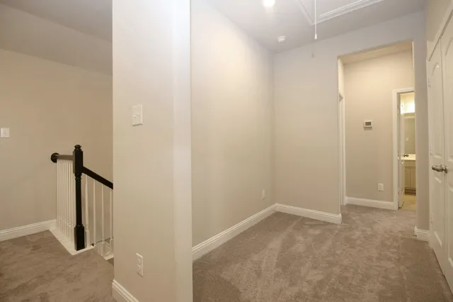 an empty room with a mirror