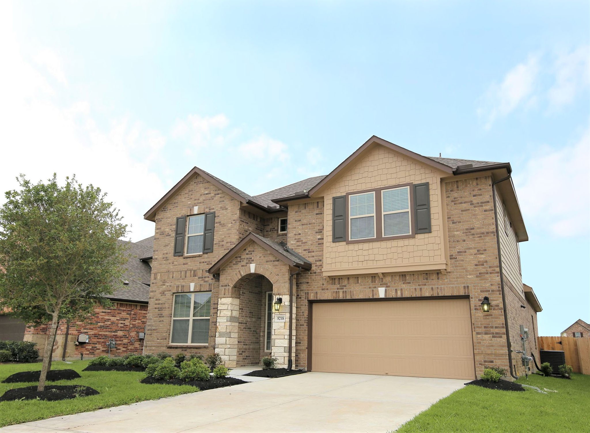 8218 Oxbow Manor Lane Cypress, TX 77433 - Photo 2 of 37 a front view of a house with garden