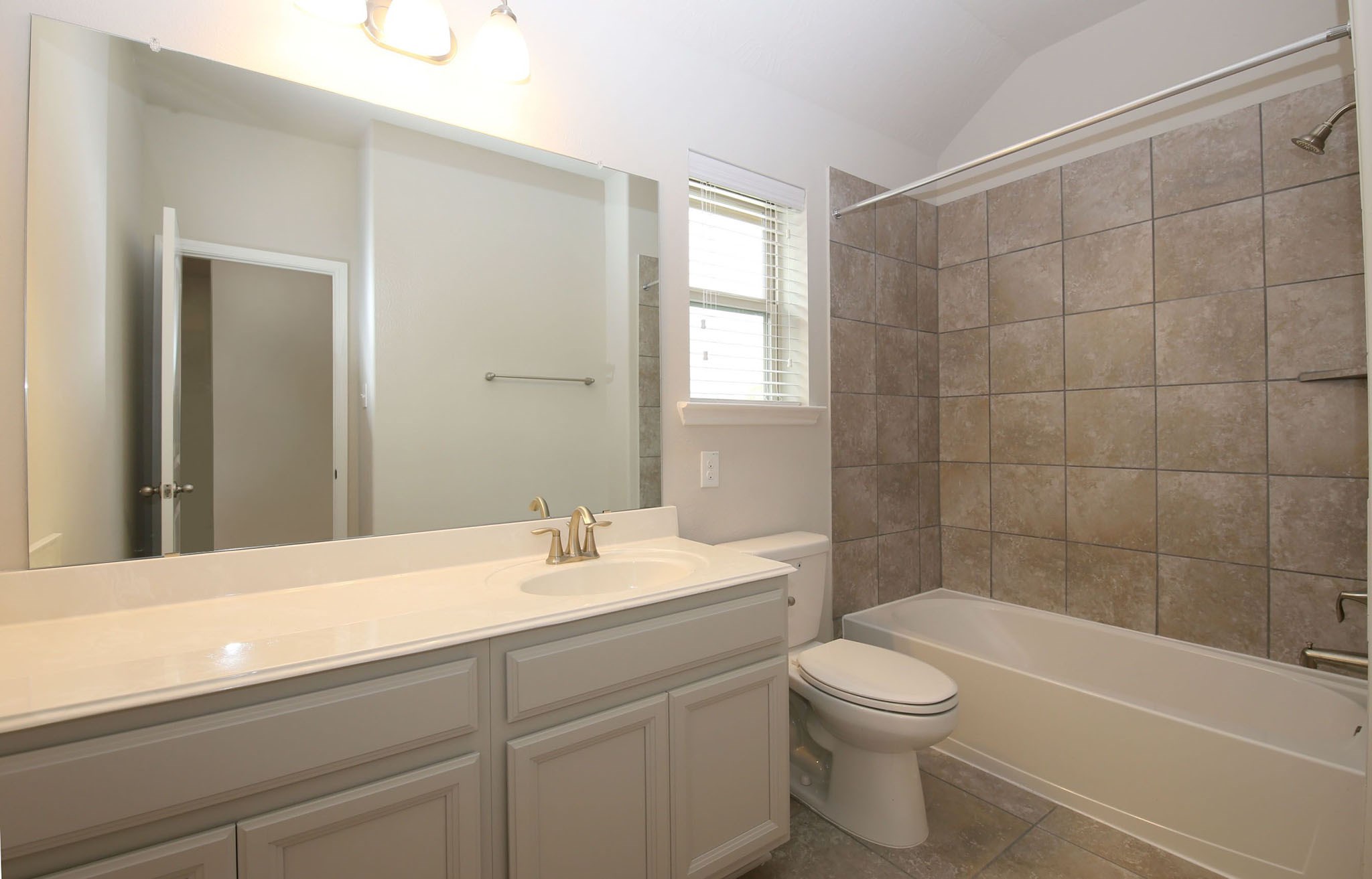 8218 Oxbow Manor Lane Cypress, TX 77433 - Photo 23 of 37 a bathroom with a sink a toilet and shower