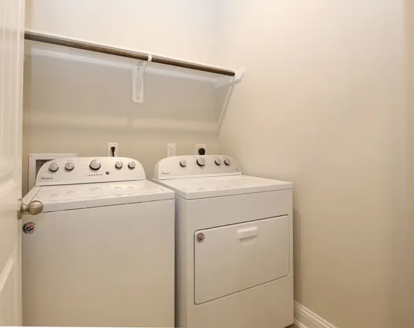 a bathroom with a tub and shower