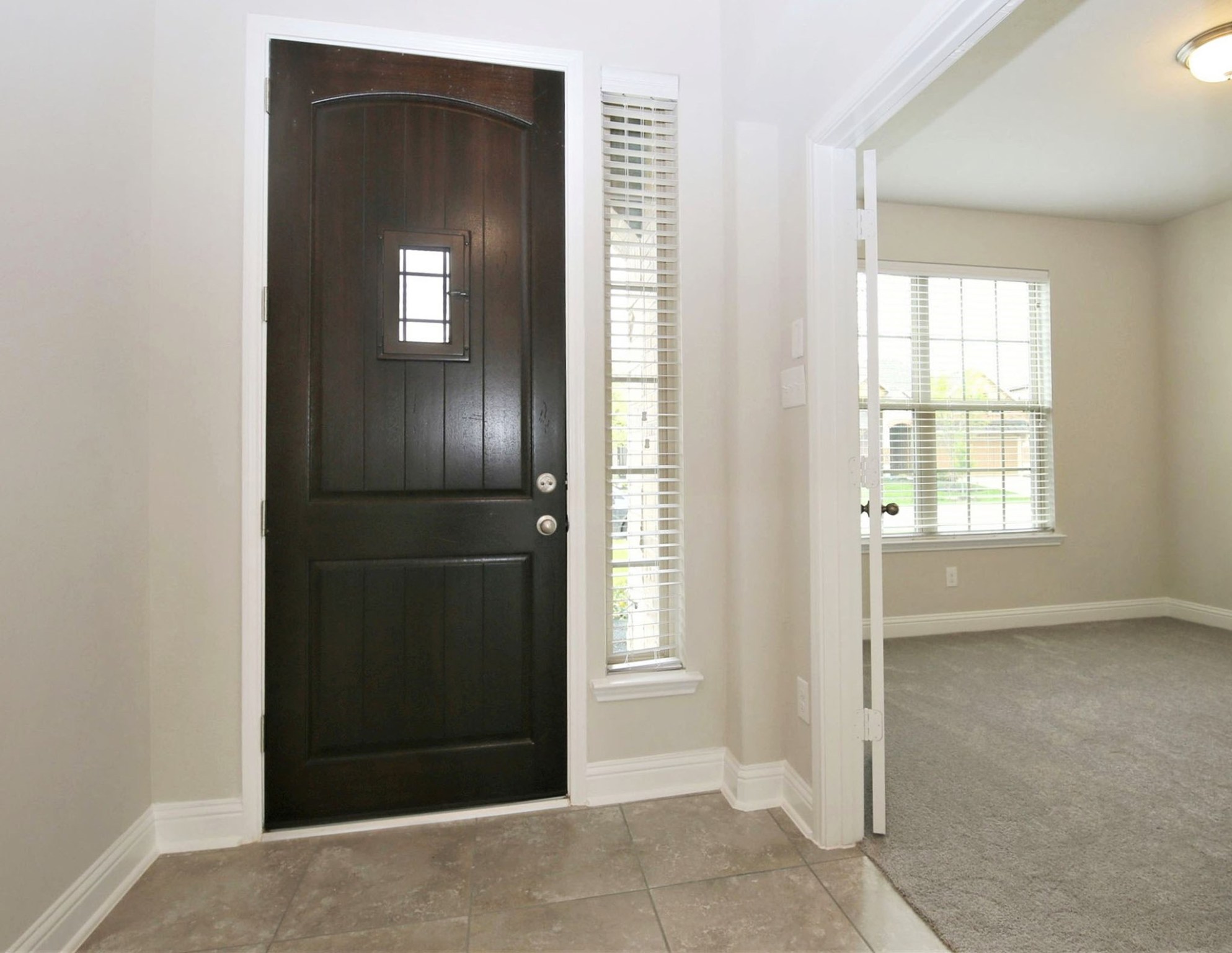 8218 Oxbow Manor Lane Cypress, TX 77433 - Photo 3 of 37 an empty room with closet and windows