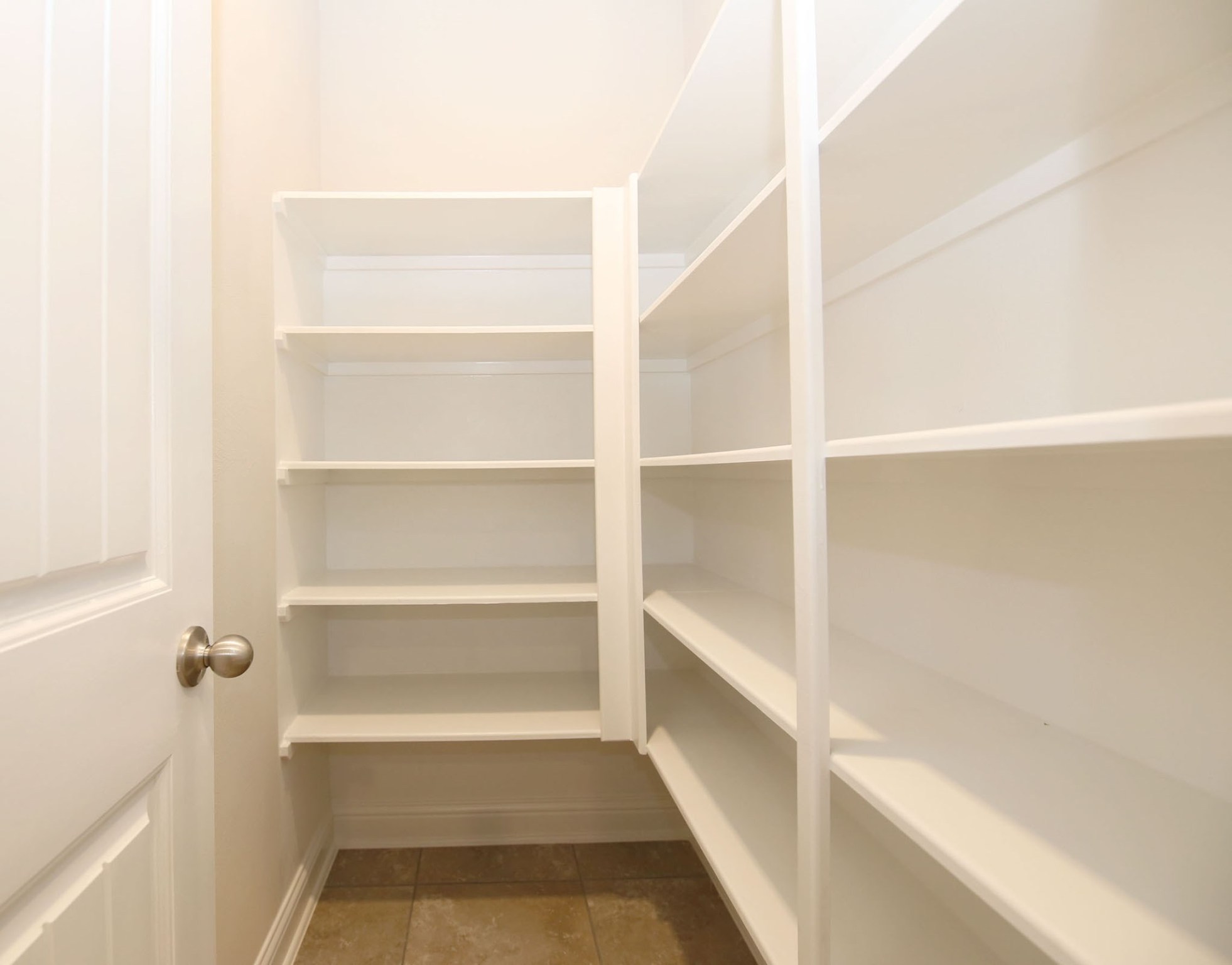 8218 Oxbow Manor Lane Cypress, TX 77433 - Photo 31 of 37 a view of walk in closet with empty racks