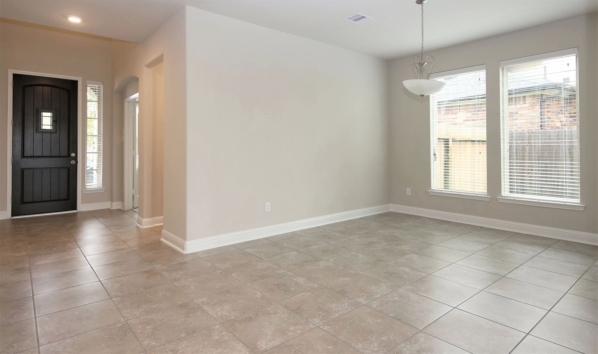 8218 Oxbow Manor Lane Cypress, TX 77433 - Photo 4 of 37 a view of an empty room with a window