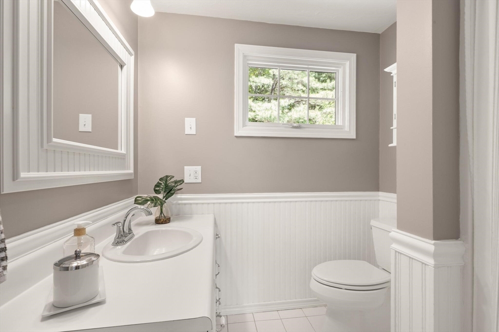 67 Bridle Path Franklin, MA 02038 - Photo 20 of 35 a bathroom with a sink and mirror with toilet