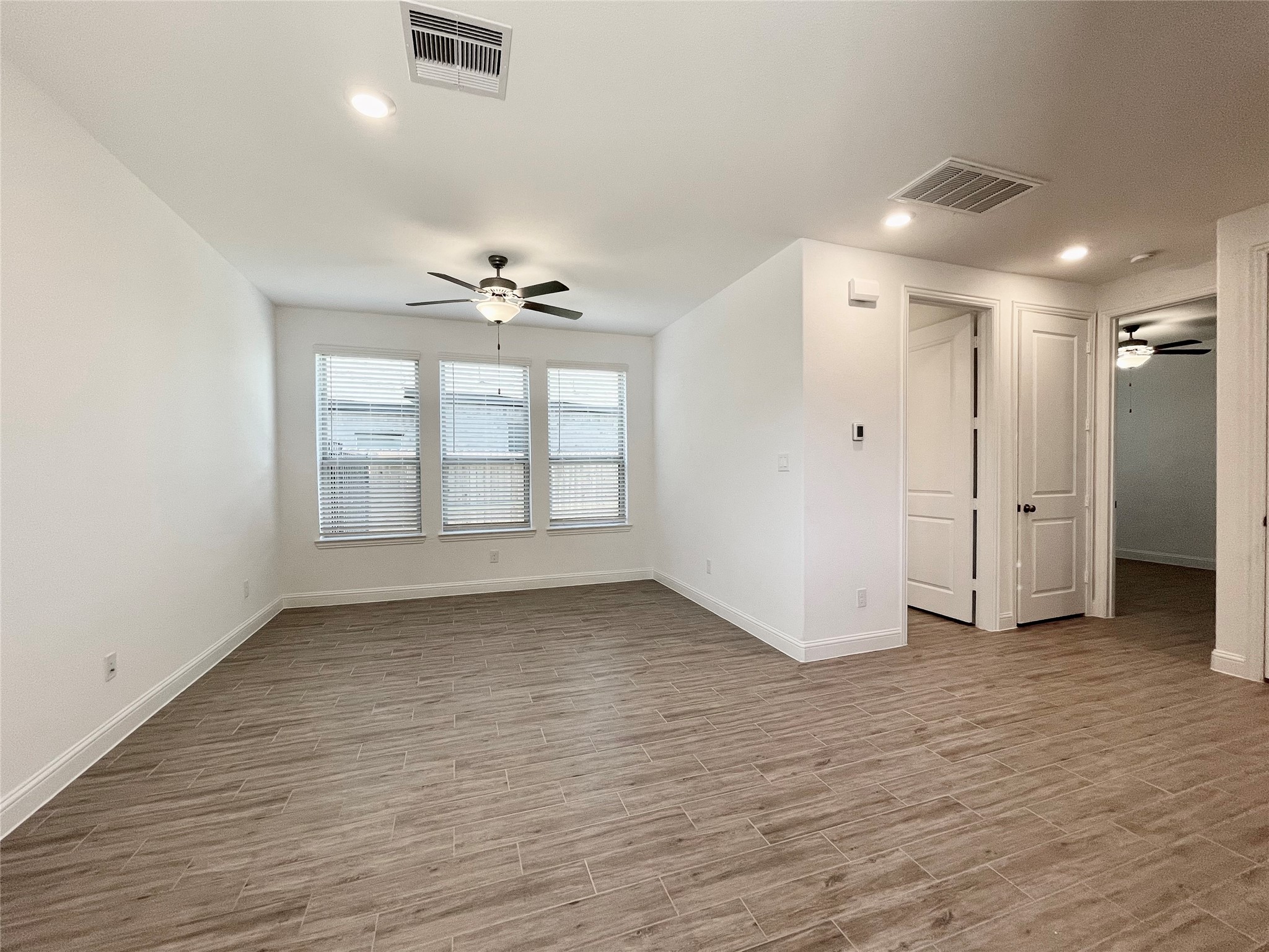 29806 Cherry Vine Road Katy, TX 77494 - Photo 26 of 30 wooden floor in an empty room with a window