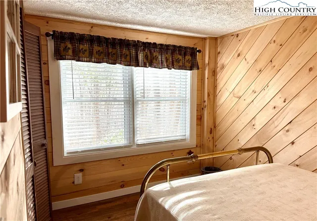 a view of a dining room with furniture wooden floor and chandelier