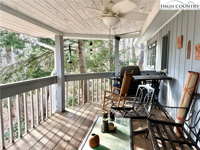 a bedroom with a bed and a refrigerator