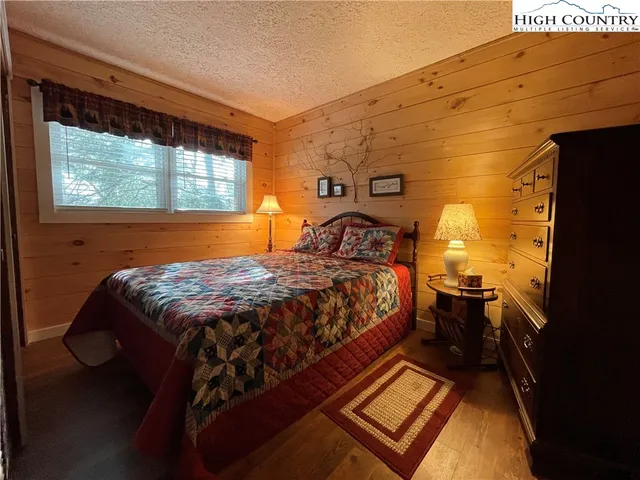 a swimming pool with outdoor seating and yard