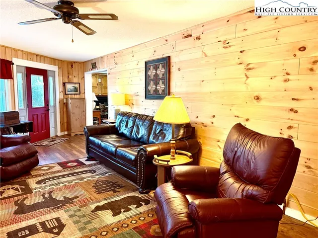 a living room with furniture and a rug