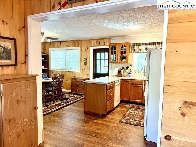 a view of a kitchen with a sink and cabinets