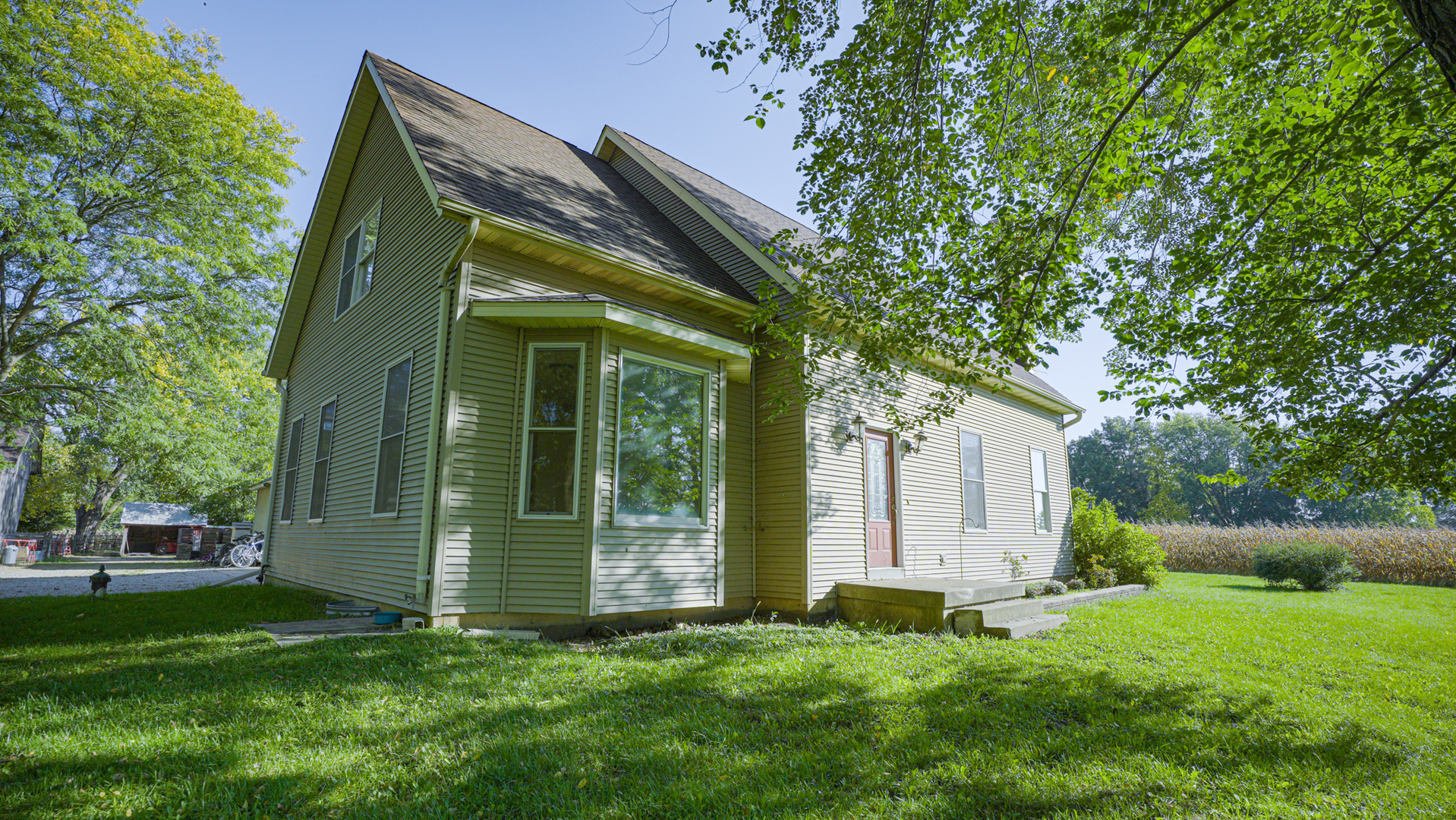 9282 East Hemstock Road Rochelle, IL 61068 - Photo 2 of 68 a view of a back yard of the house