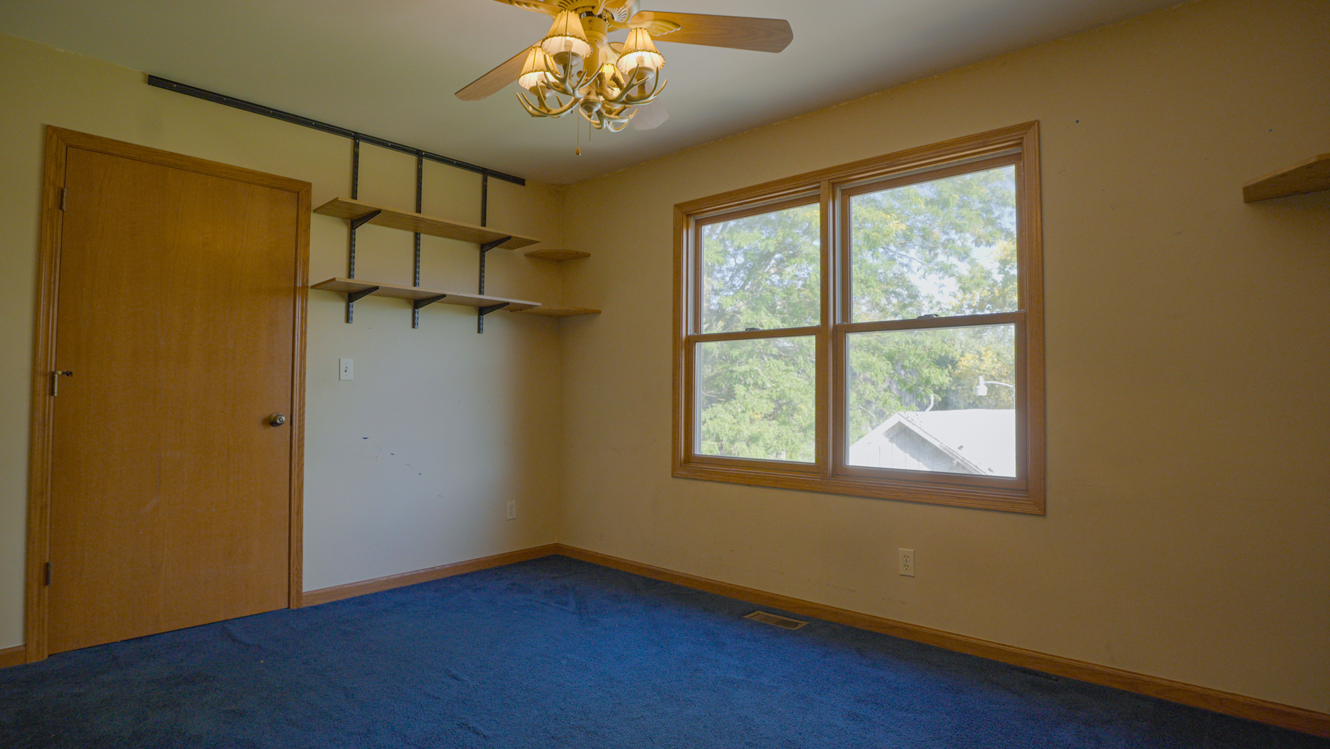 9282 East Hemstock Road Rochelle, IL 61068 - Photo 23 of 68 a view of a room with a window and a chandelier fan