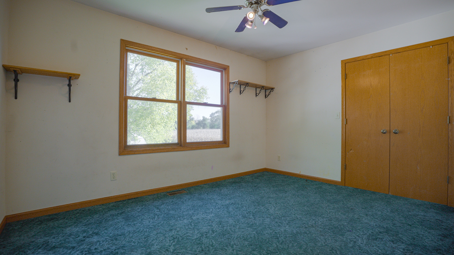 9282 East Hemstock Road Rochelle, IL 61068 - Photo 25 of 68 a view of an empty room with a window