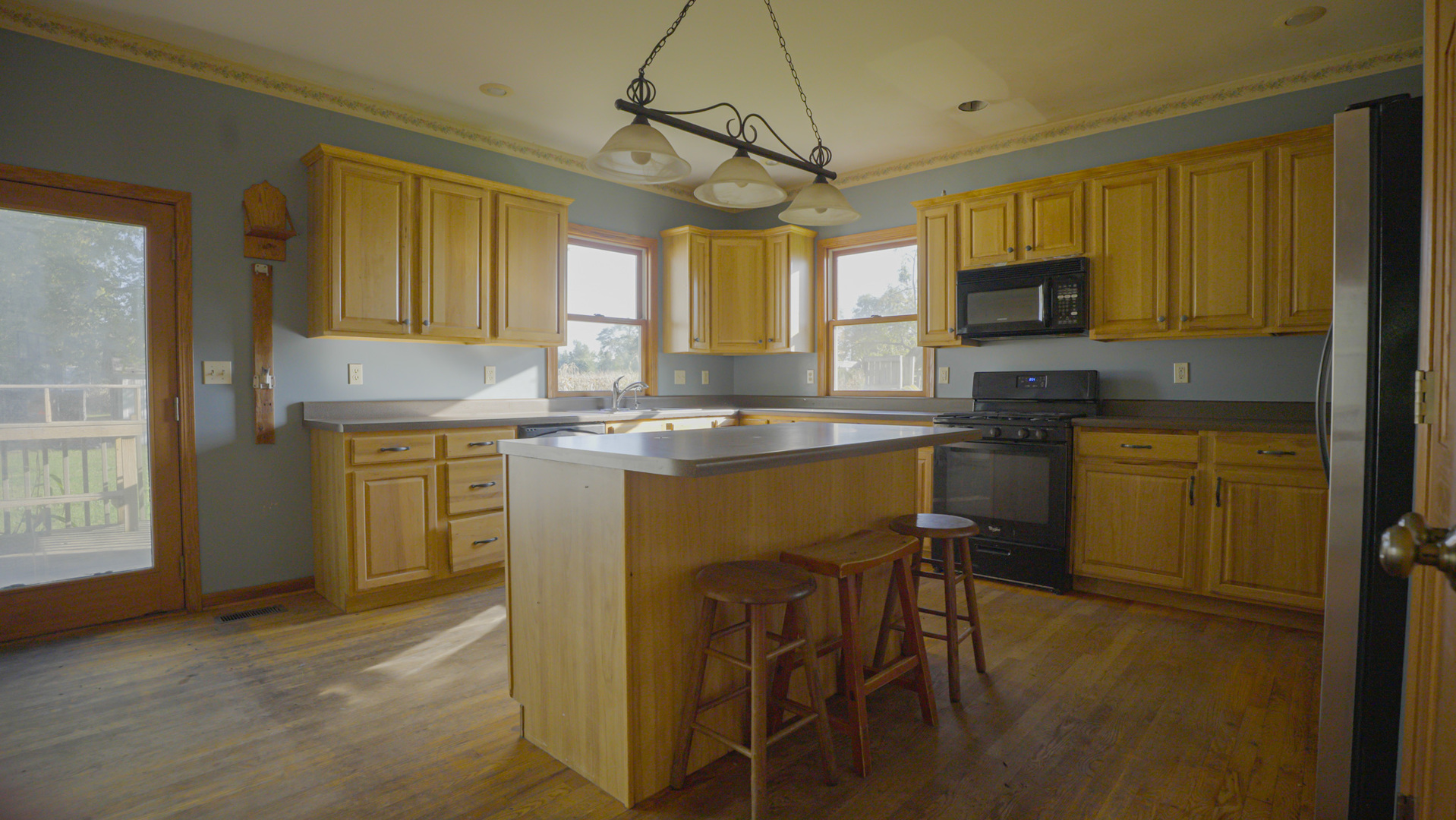 9282 East Hemstock Road Rochelle, IL 61068 - Photo 7 of 68 a kitchen that has a lot of cabinets in it and appliances