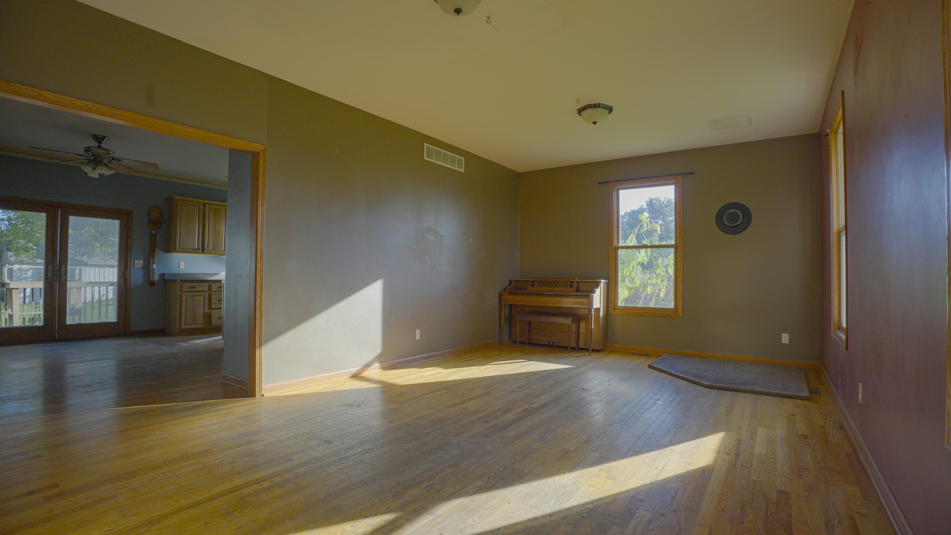 9282 East Hemstock Road Rochelle, IL 61068 - Photo 9 of 68 a view of a livingroom with an empty space and a workspace