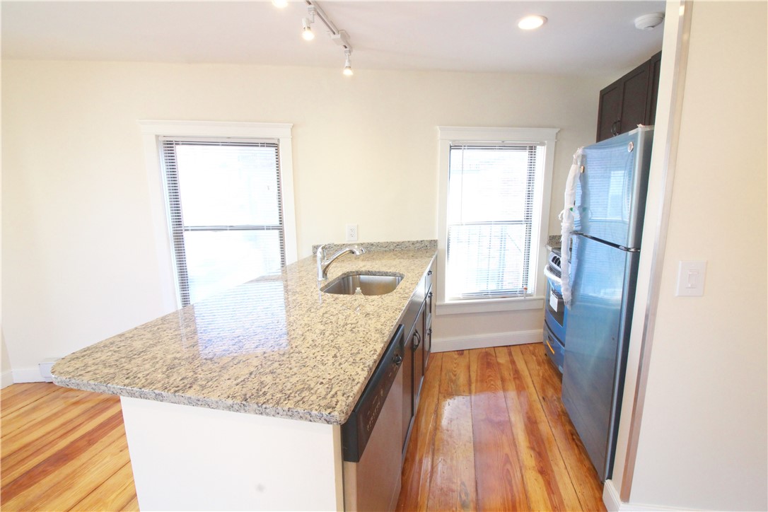 3 Spring Street, Unit 2 Newport, RI 02840 - Photo 13 of 16 kitchen. Dishwasher, electric stove, granite countertops.