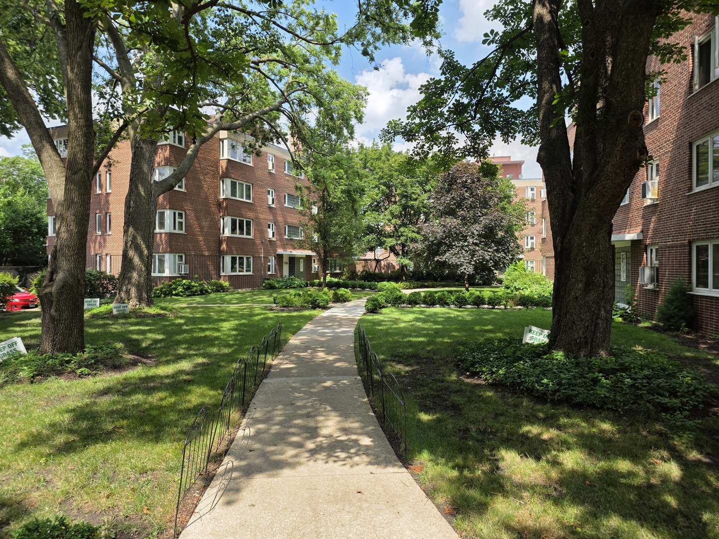 7210 Oak Avenue, Unit 3SW River Forest, IL 60305 - Photo 2 of 20 a view of a brick house next to a yard with big trees