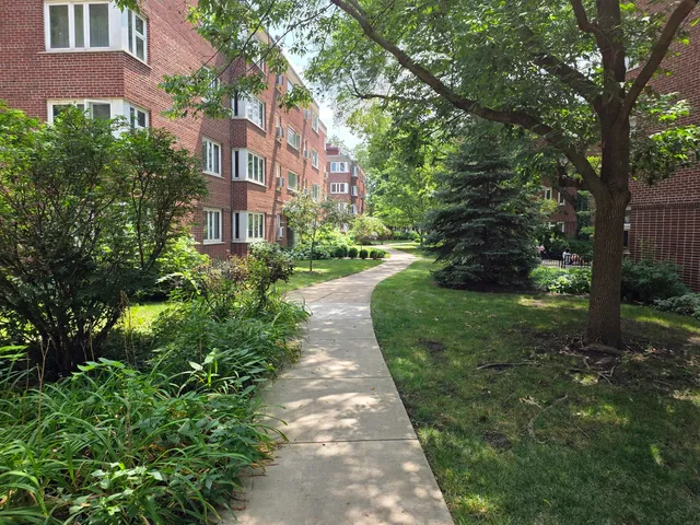 a view of a building with a yard