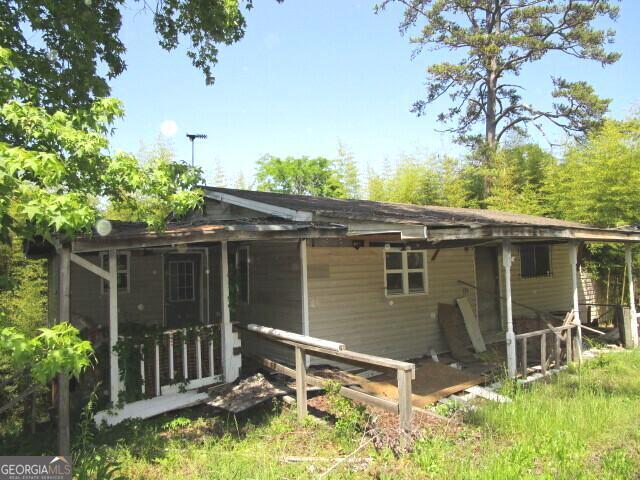 190 Youngblood Road Southeast Milledgeville, GA 31061 - Photo 2 of 37 a backyard of a house with lots of green space