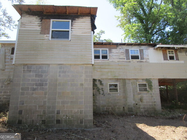 190 Youngblood Road Southeast Milledgeville, GA 31061 - Photo 25 of 37 a view of a brick house with large windows