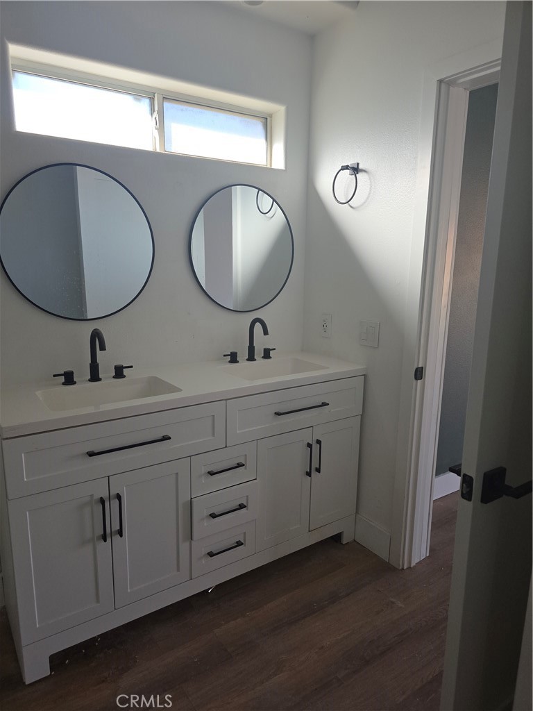 57336 Crestview Drive Yucca Valley, CA 92284 - Photo 14 of 19 a bathroom with a double vanity sink and a mirror