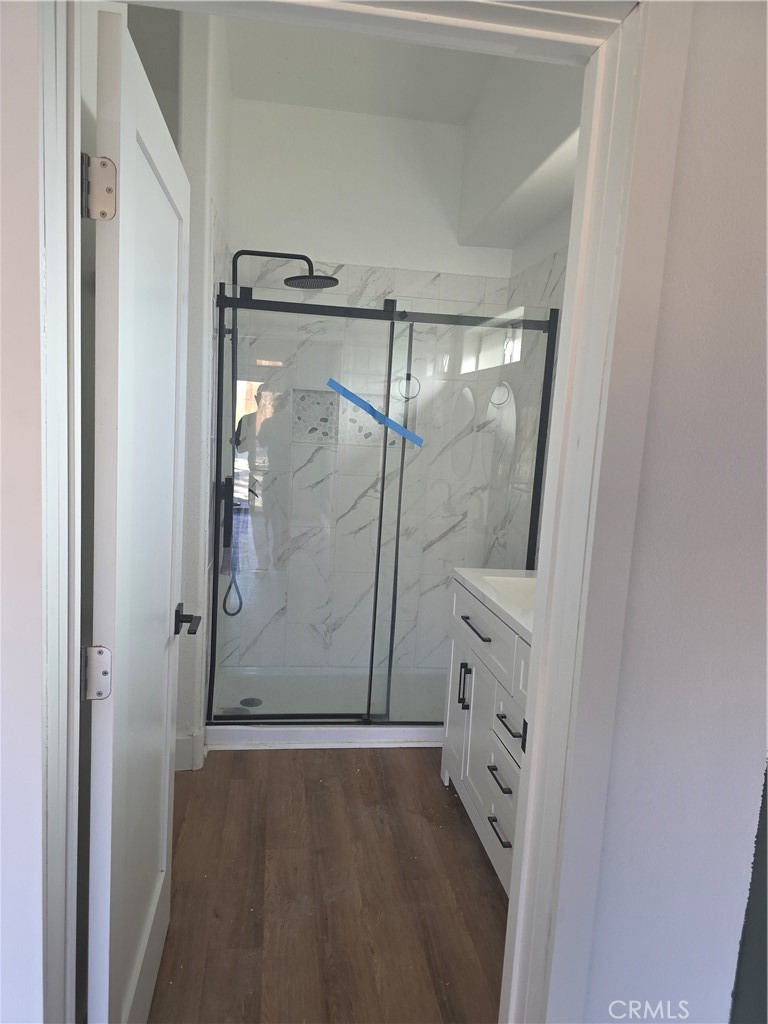 57336 Crestview Drive Yucca Valley, CA 92284 - Photo 16 of 19 a bathroom with a glass shower door