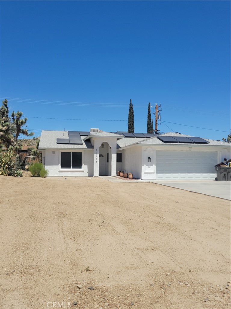 57336 Crestview Drive Yucca Valley, CA 92284 - Photo 2 of 19 a view of a house with a yard