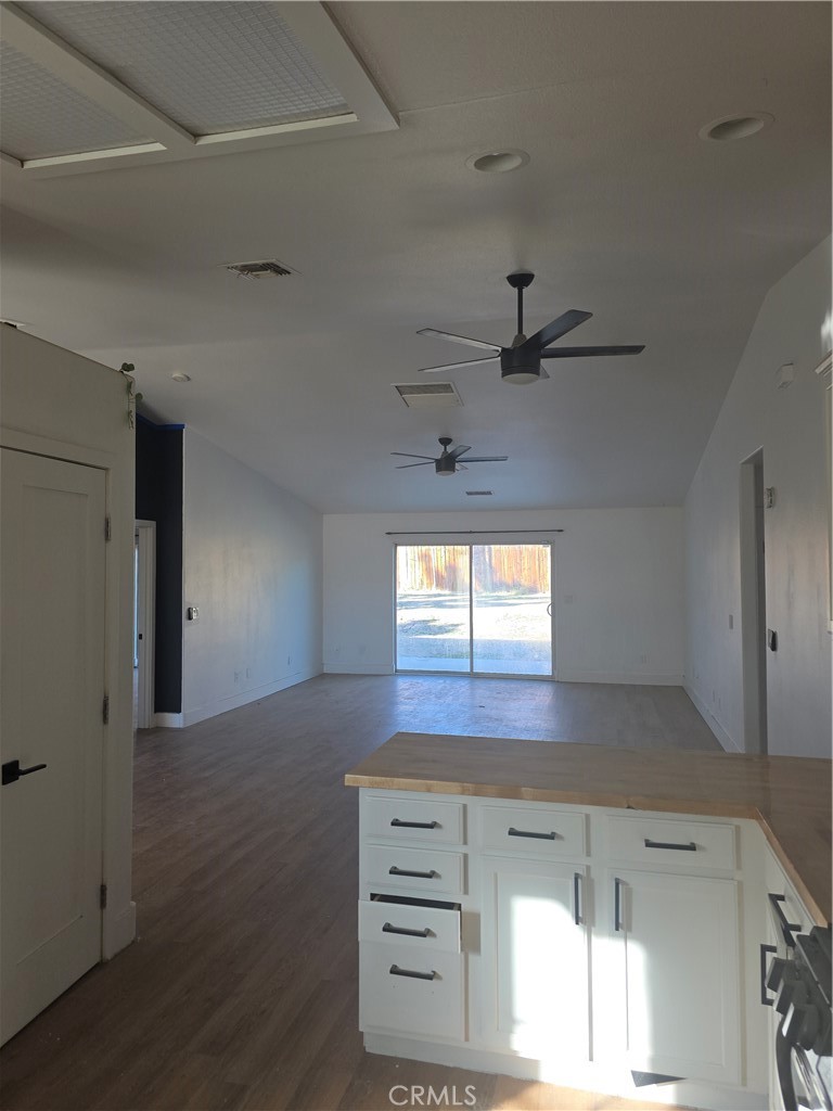 57336 Crestview Drive Yucca Valley, CA 92284 - Photo 5 of 19 a view of a hallway to room with wooden floor