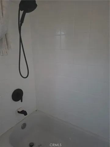 a bathroom with double vanity sink a mirror and a window