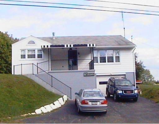 Exterior Front. Roof approximately 12 years old.  Double Vinyl Windows (Approximately 4-5 years old.