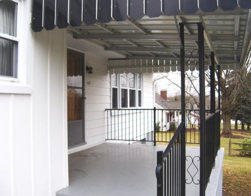Patio/Deck. Front porch has a storage room underneath.