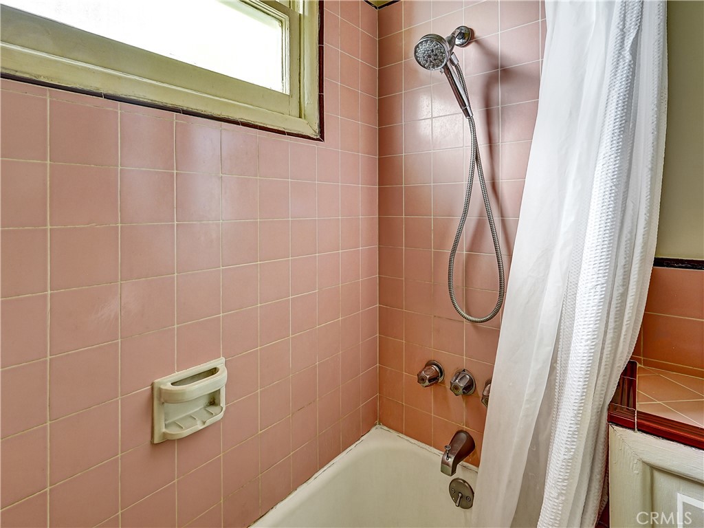 7928 Milton Avenue Whittier, CA 90602 - Photo 13 of 27 a bathroom with a shower