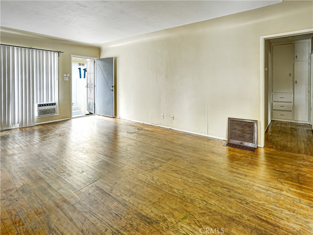7928 Milton Avenue Whittier, CA 90602 - Photo 17 of 27 a view of an empty room with wooden floor