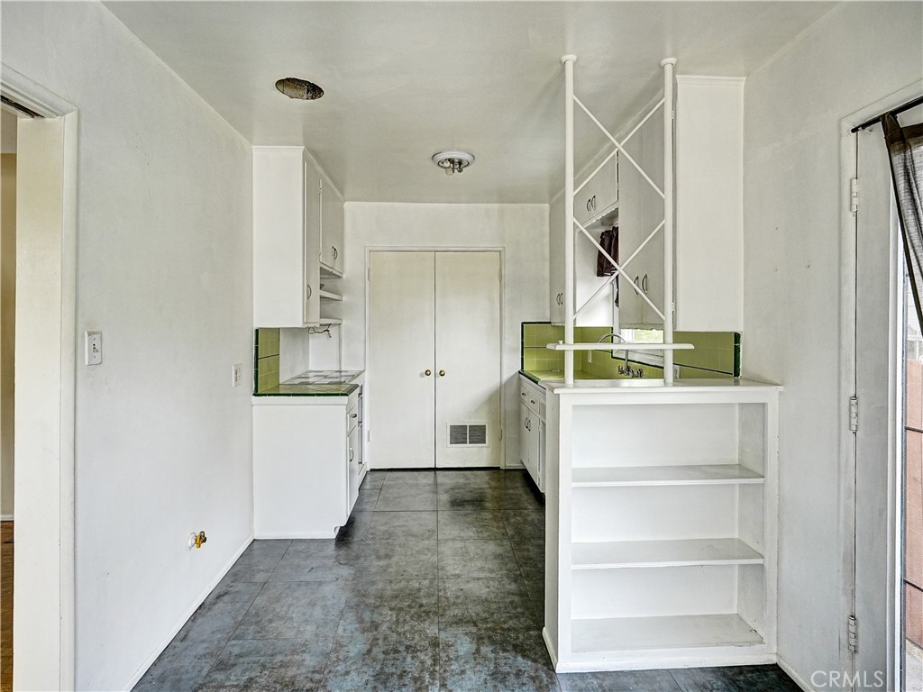 7928 Milton Avenue Whittier, CA 90602 - Photo 20 of 27 a view of hallway with stairs and wooden floor