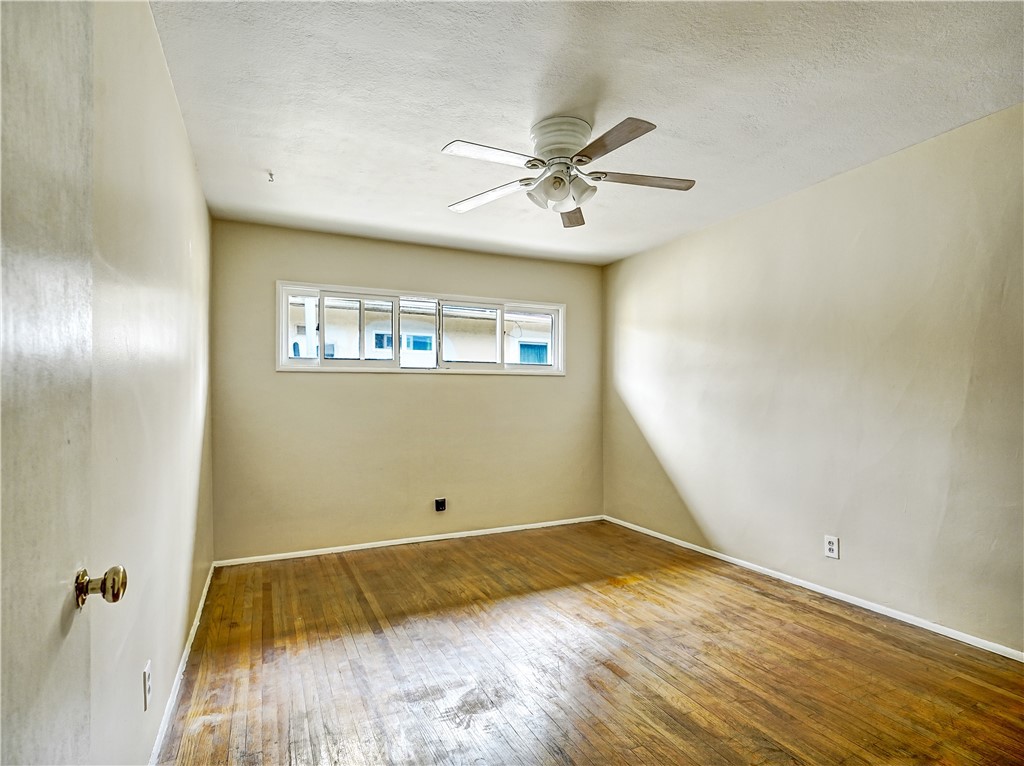 7928 Milton Avenue Whittier, CA 90602 - Photo 25 of 27 a view of a room with wooden floor and fan