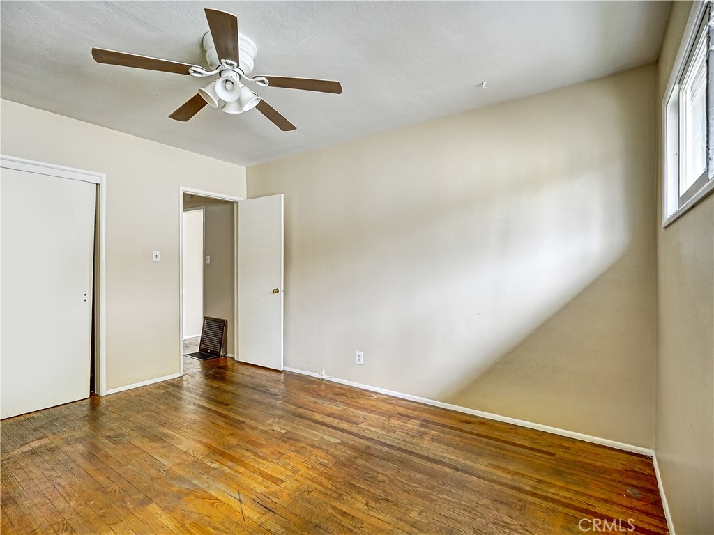 7928 Milton Avenue Whittier, CA 90602 - Photo 26 of 27 a view of an empty room with wooden floor and a window