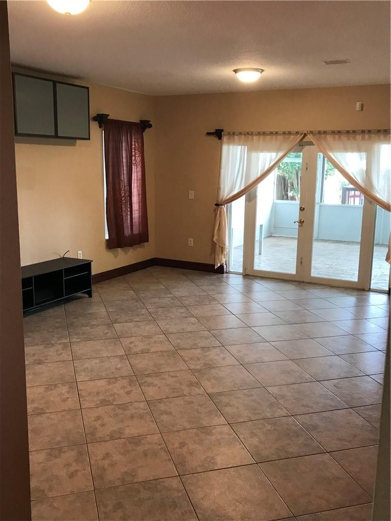 15038 Southwest 161st Place Miami, FL 33196 - Photo 4 of 23 a view of an entryway with an empty room
