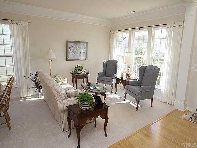 1617 October Road Raleigh, NC 27614 - Photo 2 of 9 a living room with furniture and a window