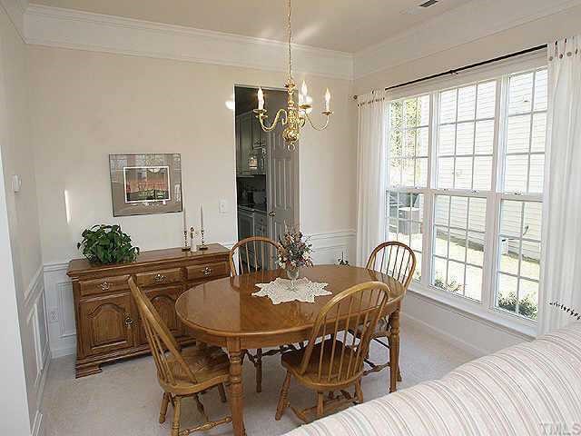 1617 October Road Raleigh, NC 27614 - Photo 3 of 9 a view of a dining room with furniture window and outside view