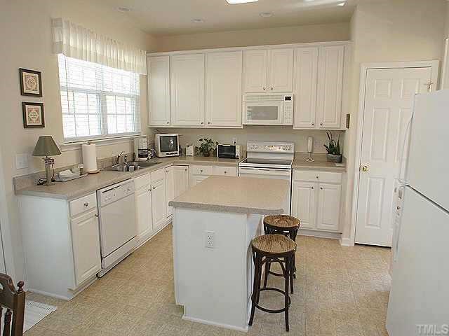 1617 October Road Raleigh, NC 27614 - Photo 5 of 9 a kitchen with a sink appliances and cabinets
