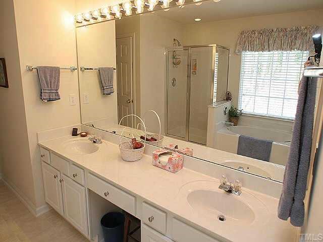 1617 October Road Raleigh, NC 27614 - Photo 8 of 9 a bathroom with a double vanity sink mirror and double